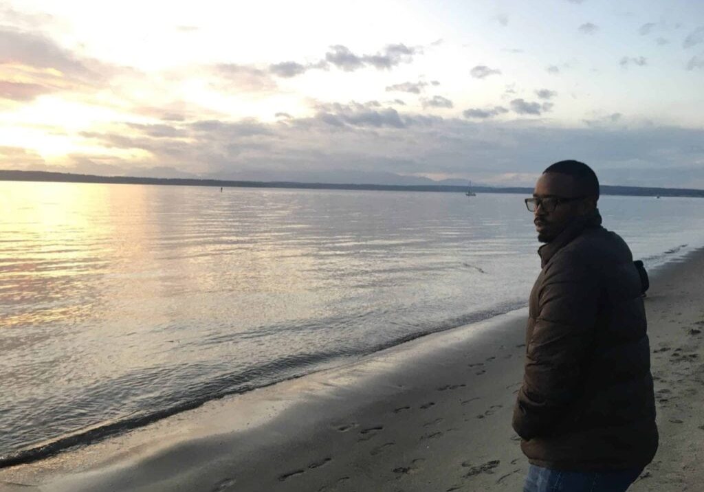 IMG-2774-scaled Person standing on the beach looking at the ocean during sunset