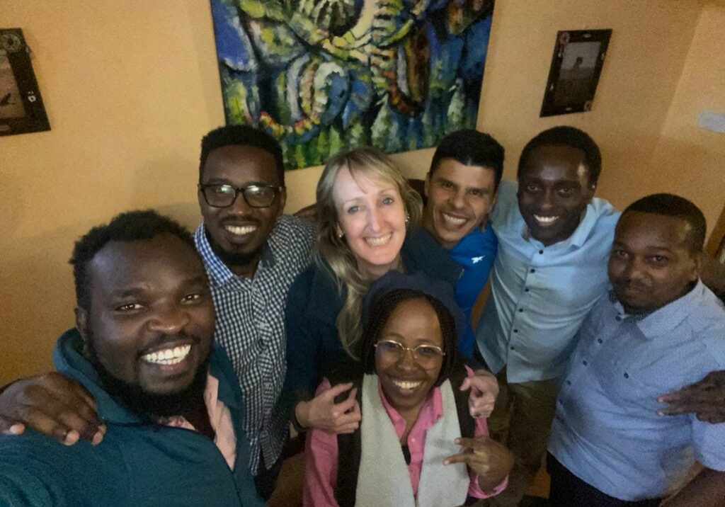 e2f625fb-1a3c-41d5-af47-c369bce777e5 Group of people smiling and posing together indoors